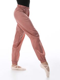 Stretch Nylon Joggers With Elastic Side Panels, Sporty Nylon Pants With Elastic Cuffs, Nylon Parachute Pants With Relaxed Fit, Stretch Nylon Joggers With Elastic Waistband, Stretch Nylon Bottoms With Tapered Leg, Spring Nylon Stretch Joggers, Spring Nylon Joggers With Elastic Waistband, Spring Stretch Nylon Joggers, Spring Nylon Pants With Elastic Side Panels