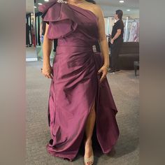 Terani Couture Dress In Merlot Color - New With Tags; Never Worn. Original Price Was $650 Elegant Purple Silk Gown, Elegant Purple Evening Gown, Elegant Purple Gown For Gala, Purple Evening Gown With Pleated Bodice, Purple Ruffled Gown For Formal Occasions, Elegant Purple Formal Gown, Purple Dress With Pleated Bodice For Gala, Elegant Purple Dress For Gala, Elegant Purple Gown For Evening