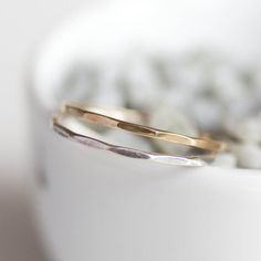 This stacking ring is a simple but yet beautiful jewel for your inner minimalist. It is a gentle and delicate piece, which you may wear alone or stacked. It is a great every-day jewel which will perfectly suit any occasion and any outfit.The ring is 0.8-0.9 mm thick. It's relatively sturdy for such a skinny band. Choose the material for the ring (sterling silver or 9k gold).You may order the ring of any size. If you are not sure about the size, this will be helpful: findmyringsize.com/If you wan Simple Yellow Gold Sterling Silver Midi Rings, Everyday Minimalist Hammered Midi Rings, Minimalist Hammered 14k Gold Stackable Rings, Hammered Sterling Silver Midi Rings, Dainty Hammered Stackable Rings As Gift, Dainty Hammered Rings, Dainty 14k Gold Hammered Rings, Dainty Hammered 14k Gold Rings, Dainty Hammered Midi Rings For Anniversary