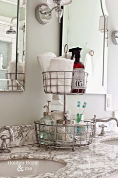 a bathroom sink with two baskets on it