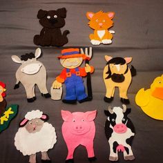 several farm animals and farm animals made out of felt