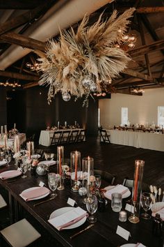 a table set up for an event with place settings