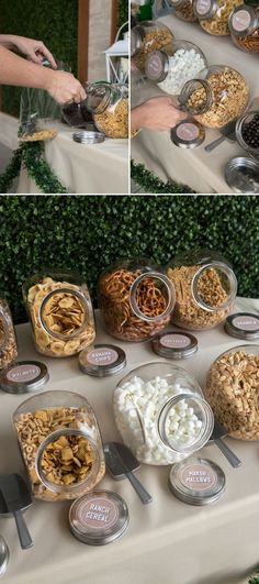 the table is covered with many different types of snacks and desserts in glass containers