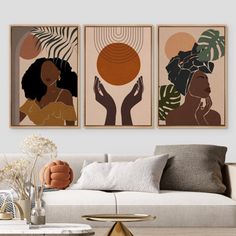 three art prints hanging on the wall above a couch in a living room with white furniture