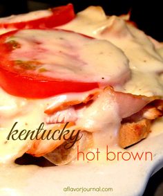 a close up of a plate of food with cheese and tomatoes on it, that says kentucky hot brown