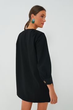 Featuring a full front placket with tortoise shell buttons, long puff sleeves, and a boxy silhouette, the Black Blake Dress is the perfect mod-inspired style. With pockets along the side seams and left chest for extra fun and function, this edgy mini is casual cool while still exuding chic sophistication. Perfect for year round wear, pair this desk to drinks number with heeled sandals for warm days ahead and swap for loafers or boots as the temperature drops. Crew neckline Long puff sleeves Full Oversized Bishop Sleeve Blouse For Work, Shell Buttons, Long Puff Sleeves, Heeled Sandals, Tortoise Shell, Puff Sleeves, Tortoise, Crew Neckline, Puff Sleeve