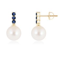 This stunning pair of earrings features a Freshwater cultured pearl suspended from a journey-inspired sapphire trail. The sapphires add a bold contrast to the subtle hue of the pearl. These classic pearl earrings are crafted in 14K yellow gold. Classic Pearl Earrings, Pearl Dangle Earrings, Freshwater Pearls Earrings, Pearl Earrings Dangle, Sapphire Earrings, The Pearl, Pearl Drop, 18k Rose Gold, Fresh Water