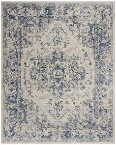 a blue and white rug with an ornate design