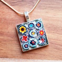 "These unique square shaped pendants have been hand-crafted with genuine Italian Millefiori glass, where beautiful glass has been produced for centuries. The glass is set in a silver tray and sealed with high quality resin to produce an one of a kind pendant. Design: Italian Millefiori Glass Colour: Multiple Pendant Size: 2.3 x 2.3cm Chain Length: Choice of 16\" - 22\" silver plated snake chain" Silver Trays, Unique Pendant, Pendant Design, Multiple Color, Snake Chain, Coach Dinky Crossbody, Chain Lengths, Colored Glass, Red Yellow