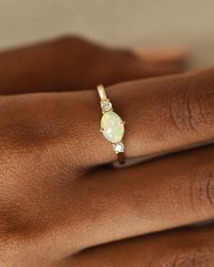 DetailsMaterial: 14k/18k GoldColor Options: Yellow Gold, White Gold, Rose Gold★ Center StoneOpal, OvalSize: 5 x 7 mmApprox Weight (Ct): 0.84★ Accent StonesDiamond, RoundSize: 2.5 mm * 2 Nos.Approx Weight (Ct): 0.1 Art Deco Opal Ring, Dreamy Rings, Jewelry Redesign, Opal Ring Simple, White Gold Opal Ring, Amethyst Rings, Opal Engagement Ring Set, Rings Opal, Opal Jewellery