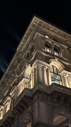 the top of a tall building lit up at night