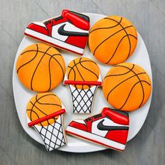 basketball cookies decorated with royal icing on a plate