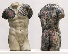 two sculptures of men with tattoos on their bodies