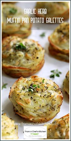 garlic herb muffins with parmesan cheese and herbs in the middle on a white plate