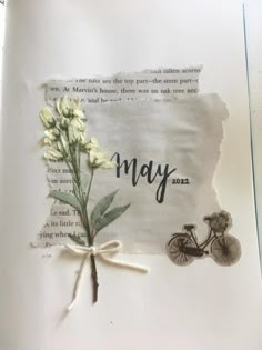 a piece of paper with flowers on it and the word may written in black ink