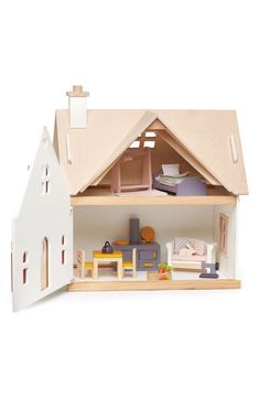 a doll house with furniture and accessories in it