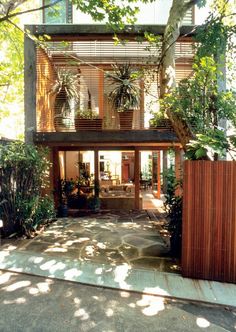 a house that is surrounded by trees and plants