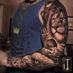 a man with a lion tattoo on his arm and hand is shown in this image