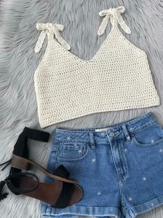 a crop top and denim shorts with high heels