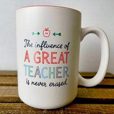 a coffee mug with the words, the influence of a great teacher is never erase