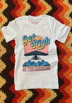 Get High in the Rockies Tee | by kaeraz | Girl Gang Tees ⚡ Vintage Style Shirts ⚡ Southwest Tees Retro Outdoor Graphic Print T-shirt, Retro Graphic Print T-shirt For Outdoor, Vintage Graphic Print T-shirt For Adventure, Vintage Adventure Graphic T-shirt, Vintage Graphic Print T-shirt For Outdoor, Vintage T-shirt With Letter Print For Outdoor Activities, Vintage Screen Print T-shirt For Outdoor Activities, Vintage Screen Print T-shirt For Outdoor, Retro Crew Neck T-shirt For Outdoor Activities