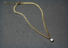 "This is our brand Mixed Metal Gold Curb Chain Necklace with Silver Lock Pendant. Total length 18\" (2\" extension available upon request only). Industrial vibe. This item is guaranteed to ship within 3-5 business days of payment. I make all of my items with my own 2 hands and with 100% TLC. I take pride in making sure my customers are very happy with their purchases, so we guarantee all items within 7 days of delivery. If you are not happy with your item, you may return within 7 days for a full refund on the cost of the item. Thanks so much for stopping in and have a wonderful day" Gold Curb Chain, 2 Hands, Lock Pendant, Chain Lock, Curb Chain Necklace, Lock Necklace, Clay Necklace, Teardrop Necklace, Mixed Metals