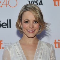 the actress is smiling for the camera on the red carpet at the toronto film festival