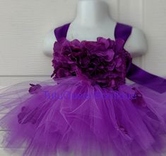 Our Beautiful full tutu dress is made out of high end soft tulle material . Sizes are according to USA STANDARD SIZING. Tutu straps is tied comfortably in the back for a perfect fit ! Color Combo Choices : Are listed in Details but you can also custom color choice ! Message me your custom colors. Flowers may vary depending on availability but will be purple and lavender. 📭ALL tutus and dresses are shipped in Arrives through USPS after scheduled delivery date. 📝Please read listing details. Than Red Tutu Dress, Purple Tutu Dress, Purple Tutu, Tulle Material, 1st Birthday Cake Smash, Birthday Girl Dress, Pink Tutu, Dress Cake, Tutu Dress