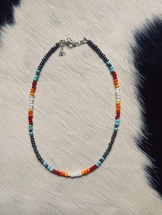 Our seed bead necklaces are made to order and can be made in several lengths. Please note shorter or longer lengths may slightly alter the pattern or how many stones are included. We use all hypoallergenic chain/cord and clasps. Please let us know if you have a pattern in mind that you don't see here! We are always open to do custom orders! All necklaces include 2 inches of chain to adjust the necklace if needed. Western Beaded Necklace Designs, Bohemian Heishi Beads Necklace With Beaded Chain, Colorful Heishi Bead Necklaces, Hippie Style Beaded Necklaces With Gemstone Beads, Bohemian Heishi Beads Beaded Bracelets, Bohemian Beaded Necklaces With Oval Gemstone Beads, Spiritual Heishi Beads Necklace For Festivals, Bohemian Oval Beads With Beaded Chain, Festival Heishi Beads Necklace With Tiny Beads