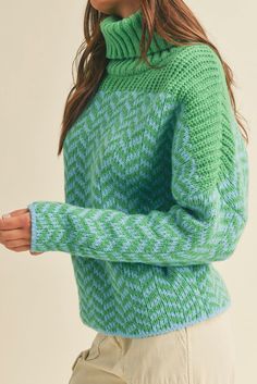 Stay warm and look great with this cozy Alpine Chevron Turtle Neck Sweater! Made from a chevron knit fabric in cool ocean tones of blue and green, ribbed turtle neck, drop sleeves, and an oversized fit, this cute sweater looks as good as it feels. Snuggle in style! Color: Blue & Green Ribbed Turtle Neck Drop Shoulder Long Sleeves Waist Length Acrylic Soft Knit Green Sweater For Layering, Trendy Green Soft Knit Sweater, Trendy Green Sweater For Layering, Trendy Green Chunky Knit Sweater, Spring Green Cable Knit Sweater, Green Textured Knit Sweater, Cozy Green Textured Knit Sweater, Spring Green Textured Knit Sweater, Trendy Green Turtleneck Sweater