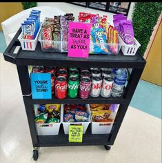 a shelf filled with lots of different types of snacks and drinks on top of it