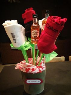 an arrangement of socks and alcohol in a cup