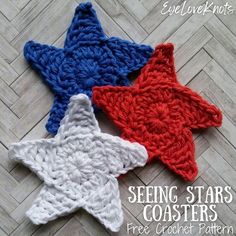 three crocheted stars sitting on top of a wooden floor with text overlay reading seeing stars coasters free crochet pattern