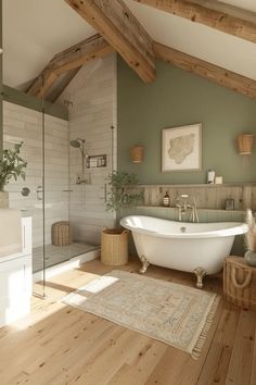 a bathroom with a tub, rug and wooden flooring in front of the bathtub