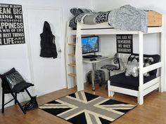 a white bunk bed sitting in a bedroom on top of a hard wood floor next to a black and white rug