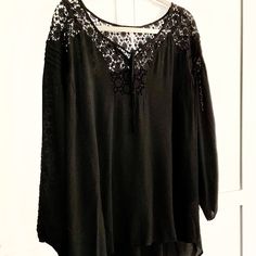 Really Beautiful Peasant Blouse In Solid Black And Trimmed In Crochet Lace. . Note The Lace Yoke In Front Continues Across Shoulder And Across The Back There Are Lace Inserts Down The Length Of The 25” Peasant Style Sleeve. The Blouse Is Labeled Size Large, But Do See Measurements As It Runs Large And Full Plus The Raglan Style Sleeves Allow For A Much Fuller Fit Through The Bust. Very Nice. New Without Tag From The Back Of The Closet. It Is 100% Rayon And Lace Is 100% Cotton. Measurements: Bust Flowy Lace Trim Blouse For Fall, Black Rayon Blouse For Fall, Fall Flowy Blouse With Lace Trim, Bohemian Black Long Sleeve Tunic, Black Bohemian Long Sleeve Tunic, Flowy Long Sleeve Black Blouse, Black Peasant Blouse With Floral Embroidery, Black Folk Style Peasant Top, Black Bohemian Lace Top