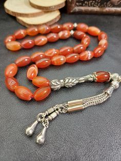 Carnelian (Yemeni Agate) Prayer Beads - Symbol of Energy and Courage 🌟 Product Description: This unique Carnelian (Yemeni Agate) prayer bead combines the energy and beauty of natural stones with exquisite craftsmanship. Each bead is carefully selected and crafted from high-quality carnelian stones, offering you both aesthetic appeal and the positive energy of natural stones. 🔹 Stone Features: - Carnelian (Yemeni Agate): Enhances courage and motivation, supports creativity. Provides physical an