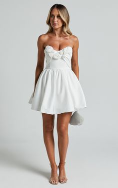 Angeletta Mini Dress - Sweetheart Rosette Detail Fit & Flare in White | Showpo Chic Dresses For Bridal Shower In Spring, Spring Mini-length Bridesmaid Corset Dress, Spring Bridesmaid Mini Corset Dress, White Feminine Corset Dress With Ruched Bodice, Summer Bridesmaid Mini Dress With Sweetheart Neckline, Summer Bridal Shower Dress With Sweetheart Neckline, Summer Mini Dress For Bridal Shower, Flirty Mini Dress For Wedding, Spring Bridal Shower Fitted Mini Dress