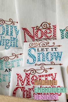 four hand towels with different designs on them and the words noel, let it snow