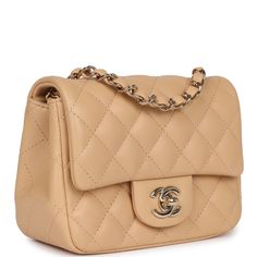 This Mini Square flap bag is in beige lambskin with gold tone hardware and has a front flap with signature CC turnlock closure, rear half moon pocket and single interwoven beige leather and gold tone chain link shoulder/crossbody strap.The interior is lined in beige leather and features a zipper pocket with Chanel pull and an open pocket below.Collection: 2022 (RFID Chip)Origin: ItalyCondition: New and never wornAccompanied by: Chanel box, and Chanel dustbagMeasurements: 6.5" width x 5" depth x 3" height; 22" strap drop Luxury Square Flap Bag With Gold-tone Hardware, Luxury Beige Shoulder Bag With Turn-lock Closure, Elegant Beige Flap Bag With Cc Turnlock Closure, Formal Beige Flap Bag With Turn-lock Closure, Beige Flap Bag With Gold-tone Hardware, Luxury Beige Flap Bag With Cc Turnlock Closure, Luxury Beige Double Flap Bag, Luxury Beige Flap Bag, Classic Beige Flap Bag With Gold-tone Hardware