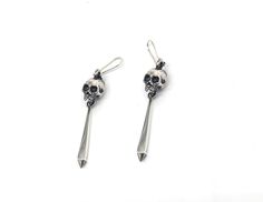 The Pendulum Earrings feature a hand carved skull with a unique pendulum drop and cast from sterling silver. Please note: These earrings are made to order and take roughly 2 - 4 weeks to make. Dimensions These earrings are 67mm long x 8mm wide and weigh 7grams each Pendulum Earrings, Skull Carving, Hand Carved, Carving, Sterling Silver, Silver