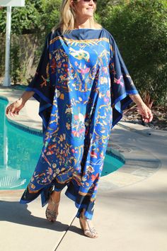 "Beautiful designer print caftan in a wonderfully, intricate floral pattern, integrated with exotic birds, and intricate scrolls, named \"Pierres d' Orient et d' Occident\".  A soft, non-sheer fabric.   One size.  Fits small to X-large sizes.  The width is 52 inches, edge to edge or 104 around the body.  The side seams are six inches from the edge.  The length is 51 inches.  Can also be made with round or V-neckline.  Wash on a short delicate cycle. Dry on low setting.  Hand wash or dry clean." Blue Kaftan, Silk Caftan, Exotic Birds, Sheer Fabric, Sheer Fabrics, Beach Dress, Dress Clothes For Women, Floral Pattern, Cover Up