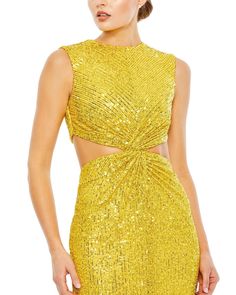 Sequin column dress with a high neckline, side cut-outs, and a back vent. Ieena for Mac Duggal Sequin Fabric (100% polyester) Fully lined High neckline Sleeveless Side and back cutouts Back vent Concealed back zipper Approx. 48" from top of shoulder to bottom hem Available in Marigold Style #27022 Glamorous Evening Dresses With Cut-out Waist, High Neck Dress With Back Opening For Cocktail, High Neck Cocktail Dress With Back Opening, Glamorous Sleeveless Backless Dress With Back Opening, Backless Party Dress With Cut-out Waist, Sleeveless Backless Dress With Keyhole Back For Cocktail, Glamorous Dresses With Keyhole Back, Sleeveless Party Dress With Keyhole Back, Sleeveless Backless Dress With Side Slits For Date Night