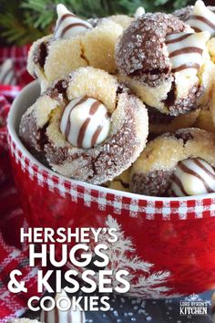 hershey's hug's and kisses cookies in a red bowl on a table