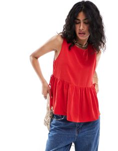 ASOS DESIGN tie side swing top in red | ASOS Chic Red Tie-back Top, Chic Red Tie Back Top, Sleeveless Tie Back Top For Day Out, Casual Sleeveless Tank Top With Tie Back, Red Casual Tie Back Top, Trendy Sleeveless Top With Tie Back, Trendy Sleeveless Tie Back Tops, Red Sleeveless Top For Day Out, Casual Sleeveless Blouse With Tie Back