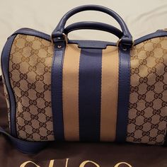 Pre-Owned Gucci Satchel Bag With Strap Only Used A Few Times And Comes With Dust Bag It's An Authentic Bag So Plz No Low Balling Gucci Monogram Canvas Satchel, Gucci Monogram Canvas Satchel For Shopping, Gucci Travel Bags With Gold-tone Hardware, Gucci Monogram Canvas Travel Bag, Blue Gucci Travel Bag, Blue Gucci Shoulder Bag With Detachable Strap, Gucci Blue Shoulder Bag With Detachable Strap, Designer Gucci Monogram Canvas Satchel, Gucci Designer Satchel With Leather Handles