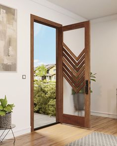 an open wooden door in a living room with potted plants on the side and outside