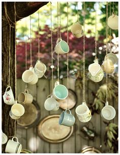 there are many cups hanging from the tree