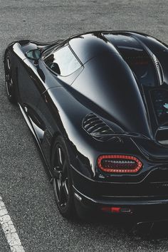 a black sports car parked on the street