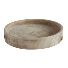 a round wooden tray on a white background